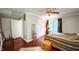 Bedroom with hardwood floors, ceiling fan, and two closets at 5728 Carriagehouse Ct, Apex, NC 27539