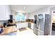 The kitchen features white cabinets, stainless steel appliances, and butcher block countertops at 5728 Carriagehouse Ct, Apex, NC 27539