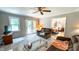 Comfortable living room leading into a dining area with hardwood floors and a view of the backyard at 5728 Carriagehouse Ct, Apex, NC 27539