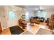 Spacious home office with hardwood floors, large windows, and lots of natural light at 5728 Carriagehouse Ct, Apex, NC 27539