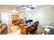Large office space with ceiling fan, hardwood floors and large windows at 5728 Carriagehouse Ct, Apex, NC 27539