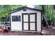 Well-maintained storage shed in the backyard offering practical storage solutions at 5728 Carriagehouse Ct, Apex, NC 27539