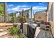 Lovely backyard featuring a patio, grill, outdoor furniture, and a well-maintained lawn at 5909 Royal Coach Ct, Raleigh, NC 27612