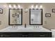 Bathroom featuring double vanity sinks and mirrors at 5909 Royal Coach Ct, Raleigh, NC 27612