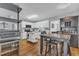 Well-lit kitchen features white cabinets, a kitchen island, and an adjacent dining area at 5909 Royal Coach Ct, Raleigh, NC 27612