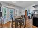 Eat in kitchen with a door to the outside and a view of the Gathering room at 5909 Royal Coach Ct, Raleigh, NC 27612