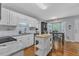 Eat-in kitchen with stainless appliances, island, and a bay window with dining table at 5909 Royal Coach Ct, Raleigh, NC 27612