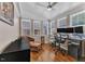 Bright office with large windows, hardwood floors, and a ceiling fan at 5909 Royal Coach Ct, Raleigh, NC 27612