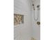 Shower showcasing a niche, wavy tile and dual shower heads at 5909 Royal Coach Ct, Raleigh, NC 27612