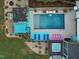 Stunning aerial view of a backyard oasis with pool, hot tub, and outdoor lounging areas at 60 Consella Way, Franklinton, NC 27525