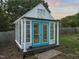 Quaint greenhouse featuring a full glass exterior and a set of double doors at 60 Consella Way, Franklinton, NC 27525