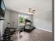 A home gym area features a treadmill, weight rack, bench, and wood floors at 60 Consella Way, Franklinton, NC 27525