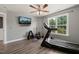 A home gym area features a treadmill, weights, TV, and window at 60 Consella Way, Franklinton, NC 27525
