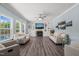 Spacious living room with fireplace and hardwood floors, featuring elegant decor and natural light at 60 Consella Way, Franklinton, NC 27525