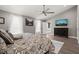 Large main bedroom with vaulted ceiling, mounted TV, and comfortable furnishings at 60 Consella Way, Franklinton, NC 27525