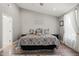 Comfortable main bedroom featuring a large bed and light-filled windows at 60 Consella Way, Franklinton, NC 27525
