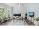 Well-lit office with large windows, a chandelier fan, and a desk setup for productivity at 60 Consella Way, Franklinton, NC 27525