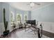 Bright home office with multiple windows, a modern desk, and stylish decor at 60 Consella Way, Franklinton, NC 27525