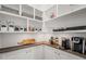 Organized pantry with white shelves, dark countertops, and various storage containers at 60 Consella Way, Franklinton, NC 27525