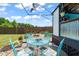 Outdoor patio with stylish blue metal table and chairs, perfect for entertaining guests at 60 Consella Way, Franklinton, NC 27525