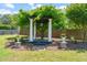 Beautiful backyard pergola surrounded by lush greenery and mature trees at 60 Consella Way, Franklinton, NC 27525