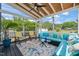Relax on this screened porch furnished with a sectional sofa and chairs at 60 Consella Way, Franklinton, NC 27525