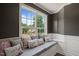 Comfortable window seat with decorative pillows overlooks the front yard at 60 Consella Way, Franklinton, NC 27525