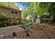 A beautiful backyard featuring a brick patio, firepit, storage shed, and swing set, perfect for outdoor activities at 600 Longleaf Dr, Chapel Hill, NC 27517
