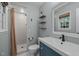 Clean bathroom featuring a tiled shower, modern vanity, and neutral finishes at 600 Longleaf Dr, Chapel Hill, NC 27517