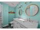 Stylish bathroom featuring double sinks, marble countertops, and modern fixtures at 600 Longleaf Dr, Chapel Hill, NC 27517