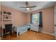 Cozy bedroom featuring a built-in bookcase and a bright window view at 600 Longleaf Dr, Chapel Hill, NC 27517