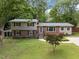 Charming two-story home with brick and siding exterior, manicured lawn, and mature trees offering curb appeal at 600 Longleaf Dr, Chapel Hill, NC 27517