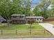 Charming home with mature trees, a brick facade, and a well-manicured lawn for curb appeal at 600 Longleaf Dr, Chapel Hill, NC 27517