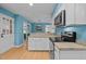 Modern kitchen featuring white cabinets, granite countertops, and stainless steel appliances, combining style and functionality at 600 Longleaf Dr, Chapel Hill, NC 27517