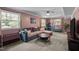 Cozy living room featuring a large sectional sofa, soft carpet, and natural light at 600 Longleaf Dr, Chapel Hill, NC 27517