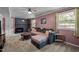 Comfortable living room features a fireplace, large sectional, and natural light at 600 Longleaf Dr, Chapel Hill, NC 27517