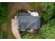 An aerial view shows the backyard, house roof and driveway at 7000 Millstone Ridge Ct, Raleigh, NC 27614
