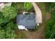 Overhead view displays the home with a deck, long driveway and mature trees at 7000 Millstone Ridge Ct, Raleigh, NC 27614