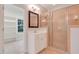 Bathroom featuring a glass-enclosed shower, vanity with storage, and a separate dressing area at 7000 Millstone Ridge Ct, Raleigh, NC 27614