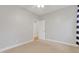 Neutral bedroom featuring carpet, ceiling fan, trim, and a window at 7000 Millstone Ridge Ct, Raleigh, NC 27614