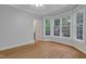 Bedroom features hardwood floors and bay window, offering plenty of natural light at 7000 Millstone Ridge Ct, Raleigh, NC 27614