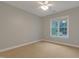 Bedroom featuring carpet floors, neutral walls, natural light from window, and a ceiling fan at 7000 Millstone Ridge Ct, Raleigh, NC 27614