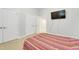 Bedroom with neutral paint, carpet, a ceiling fan and a TV at 7000 Millstone Ridge Ct, Raleigh, NC 27614