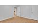 Empty bedroom with hardwood floors and neutral paint, offering versatility at 7000 Millstone Ridge Ct, Raleigh, NC 27614