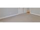 Bedroom with carpeted floor showing doors and electrical outlets at 7000 Millstone Ridge Ct, Raleigh, NC 27614