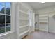 Well-organized closet with built-in shelving and natural light at 7000 Millstone Ridge Ct, Raleigh, NC 27614