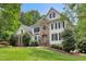 Stately two-story home with stone accents, landscaped front yard for an inviting curb appeal at 7000 Millstone Ridge Ct, Raleigh, NC 27614