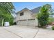 Three-car garage with a large driveway, providing ample parking space at 7000 Millstone Ridge Ct, Raleigh, NC 27614
