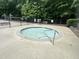 Community hot tub surrounded by a black fence with some green foliage nearby at 7000 Millstone Ridge Ct, Raleigh, NC 27614