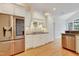 Kitchen featuring stainless steel appliances, white cabinets, a gas range and hardwood floors at 7000 Millstone Ridge Ct, Raleigh, NC 27614